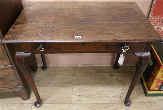 An 18th century oak side table fitted drawer